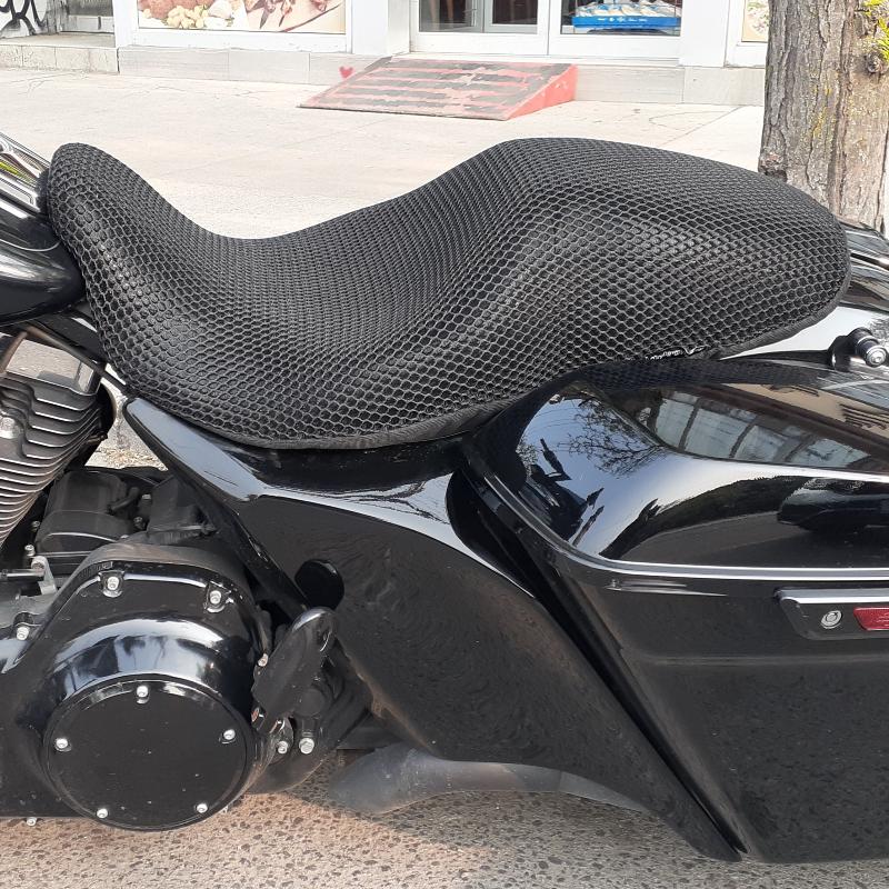 Cool Dry Covers seat covers to fit your Harley Street Glide (pictured).  Keeps you raised off the original seat, much cooler in the heat and allows air circulation.  Water goes through without being absorbed so you stay drier in the wet.  These are sized to fit your specific seat perfectly.  Transform your ride with Cool Dry Covers.