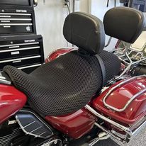 Cool Dry Covers seat covers to fit your Harley Tri Glide (pictured).  Keeps you raised off the original seat, much cooler in the heat and allows air circulation.  Water goes through without being absorbed so you stay drier in the wet.  These are sized to fit your specific seat perfectly.  Transform your ride with Cool Dry Covers.