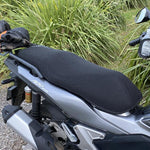 Cool Dry Covers seat covers to fit your Honda ADV150 (pictured).  Keeps you raised off the original seat, much cooler in the heat and allows air circulation.  Water goes through without being absorbed so you stay drier in the wet.  These are sized to fit your specific seat perfectly.  Transform your ride with Cool Dry Covers.