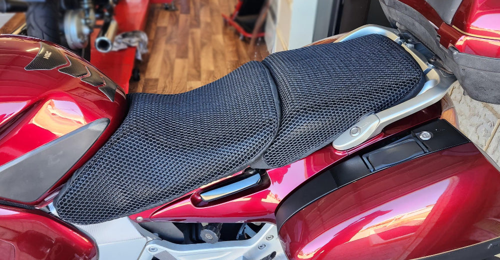 Cool Dry Covers seat covers to fit your Honda ST1300 Rider and Pillion Seats (pictured).  Keeps you raised off the original seat, much cooler in the heat and allows air circulation.  Water goes through without being absorbed so you stay drier in the wet.  These are sized to fit your specific seat perfectly.  Transform your ride with Cool Dry Covers.