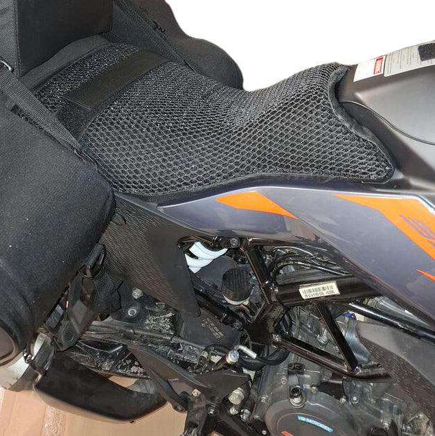 Cool Dry Covers seat covers to fit your KTM 390 Adventure Rider Seat (pictured).  Keeps you raised off the original seat, much cooler in the heat and allows air circulation.  Water goes through without being absorbed so you stay drier in the wet.  These are sized to fit your specific seat perfectly.  Transform your ride with Cool Dry Covers.